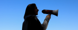 woman communicating with megaphone
