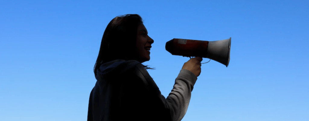 woman communicating with megaphone