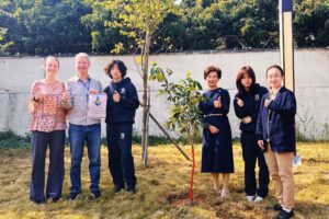 St Bees staff and students showing their commitment to sustainability in china by planting trees with Jump's founder, Graham Simmonds